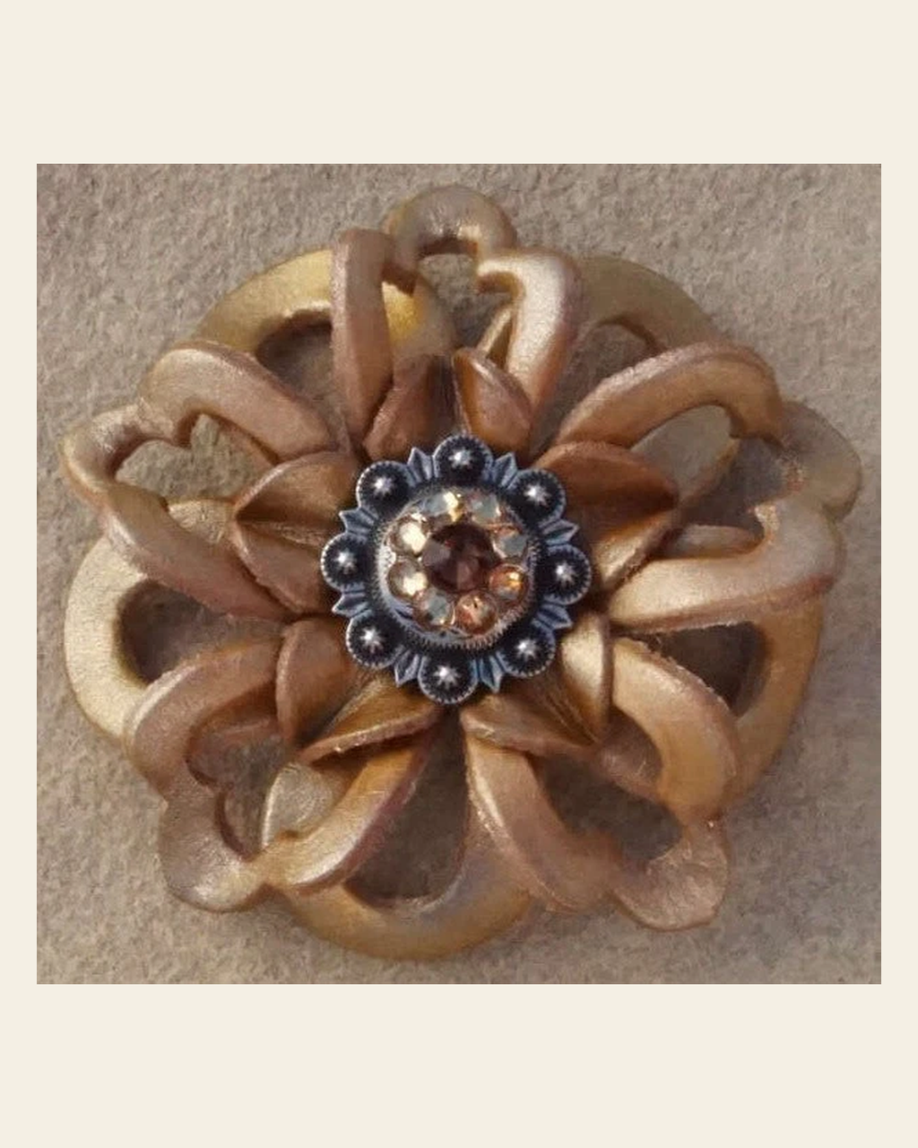 Gold Lotus Flower With Antique Silver Topaz and Champagne 1" Concho on a warm cream background