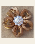 Gold Lotus Flower With Bright Silver AB 1" Concho on a warm cream background