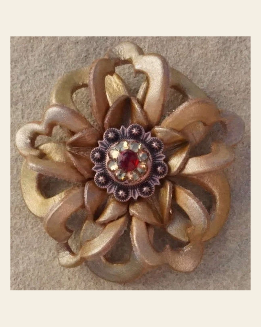 Gold Lotus Flower With Copper Ruby and Champagne 1" Concho on a warm cream background