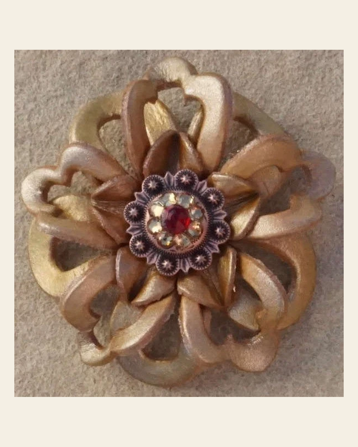 Gold Lotus Flower With Copper Ruby and Champagne 1" Concho on a warm cream background