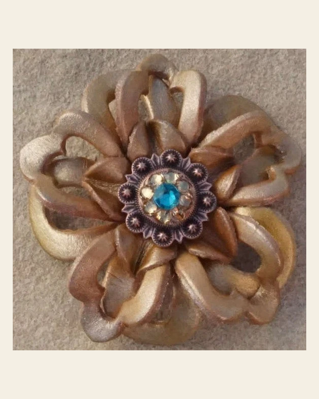 Gold Lotus Flower With Copper Teal and Champagne 1" Concho on a warm cream background