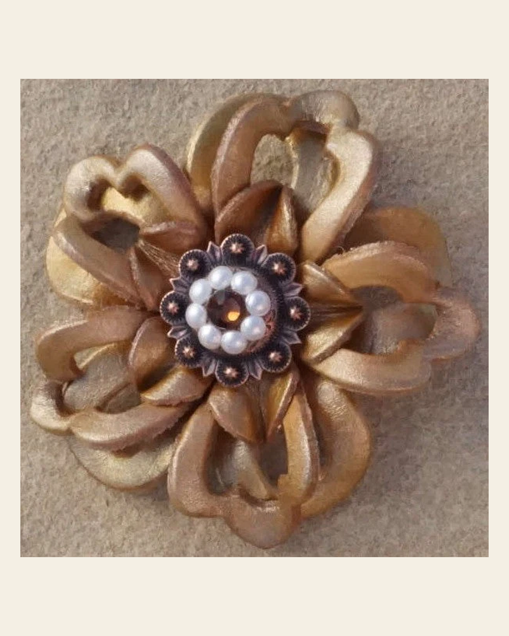 Gold Lotus Flower With Copper Topaz and Pearl 1" Concho on a warm cream background