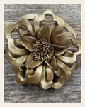 Gold Lotus Leather Flower on a warm cream background