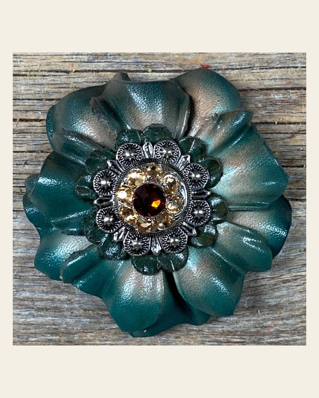 Green Carnation Flower With Antique Silver Topaz, Champagne 1" Concho on a warm cream background