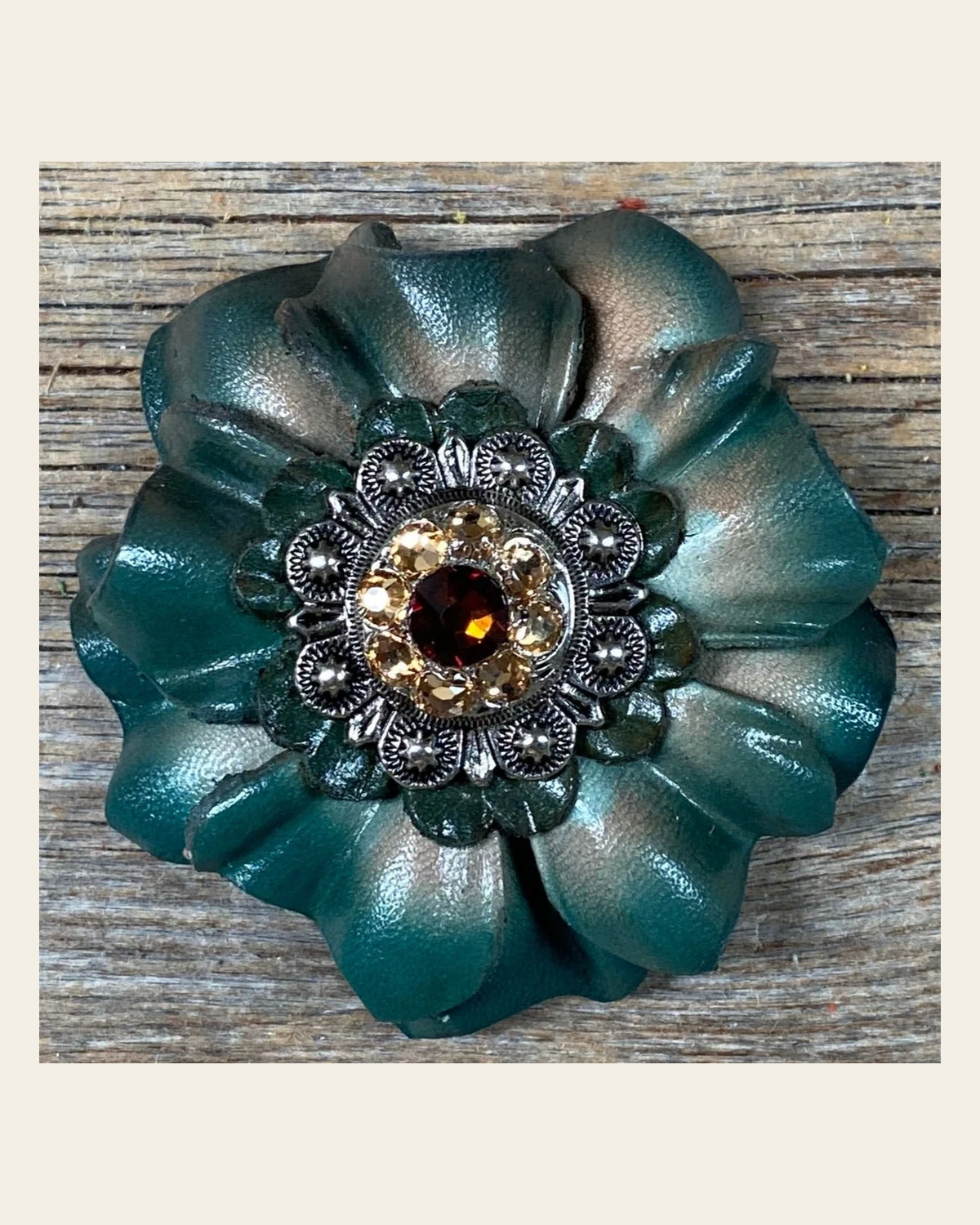 Green Carnation Flower With Antique Silver Topaz, Champagne 1" Concho on a warm cream background