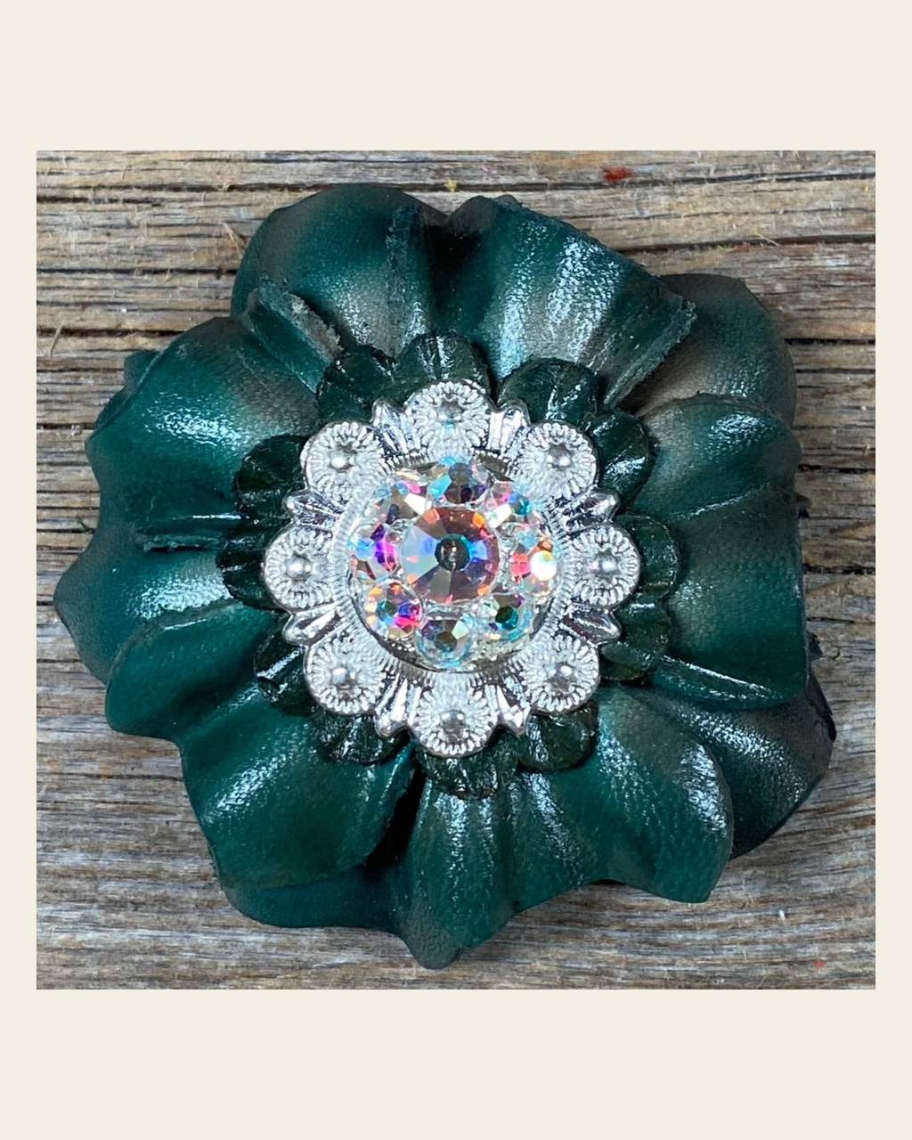 Green Carnation Flower With Bright Silver AB 1" Concho on a warm cream background