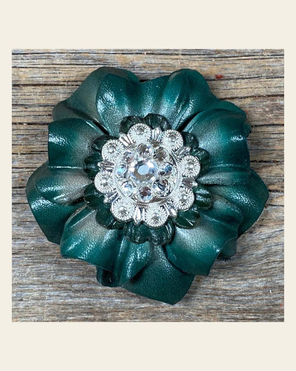Green Carnation Flower With Bright Silver Clear 1" Concho on a warm cream background