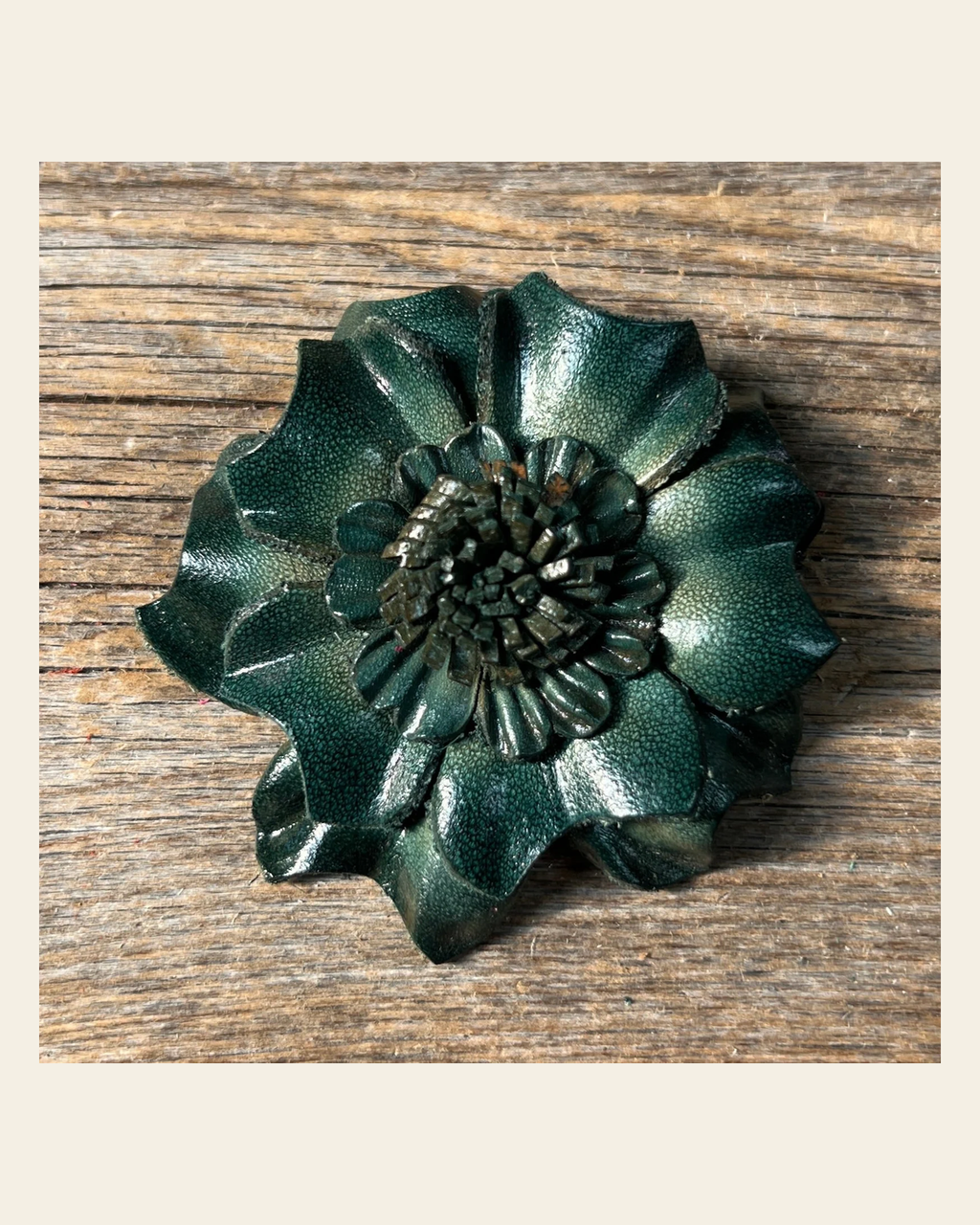 Green Carnation Leather Flower on a warm cream background