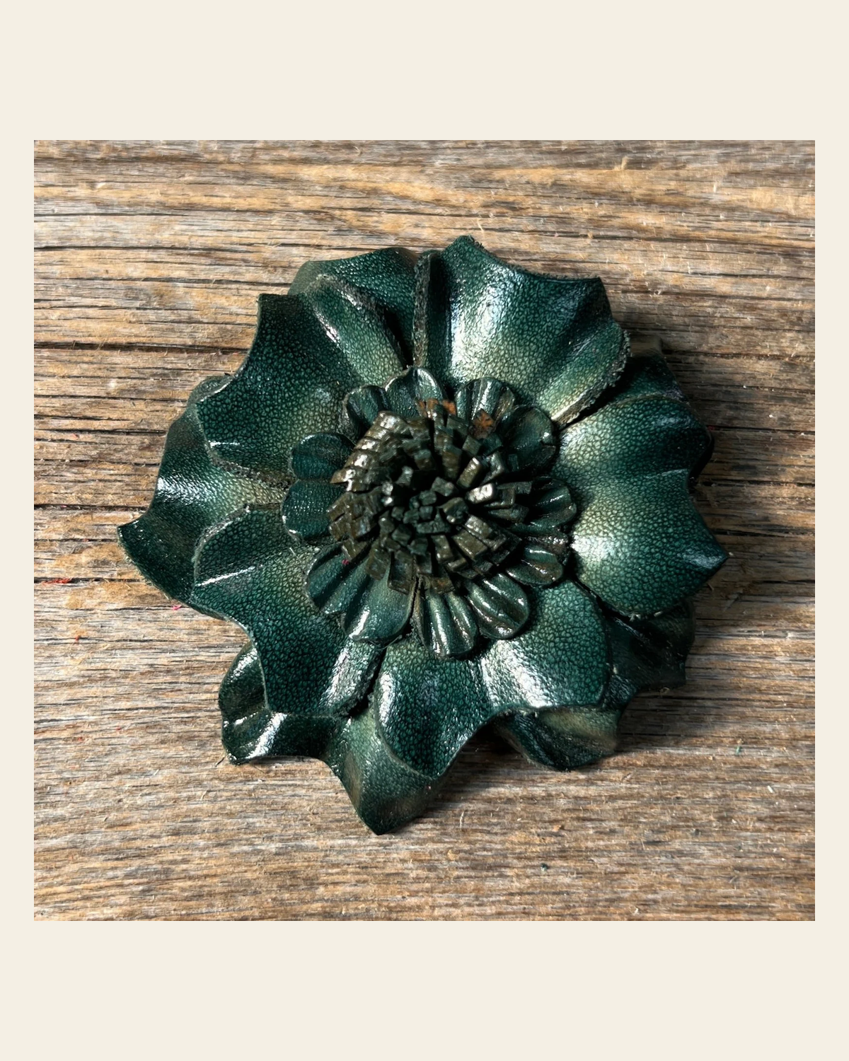 Green Carnation Leather Flower on a warm cream background