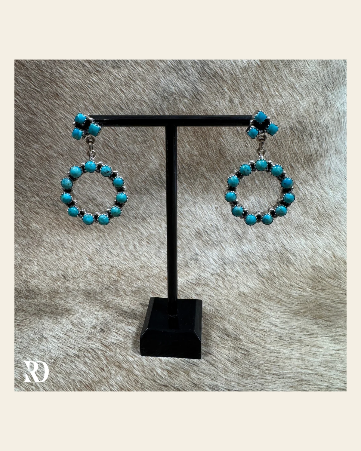 Hada Collection Authentic Kingman Turquoise Earrings on a warm cream background