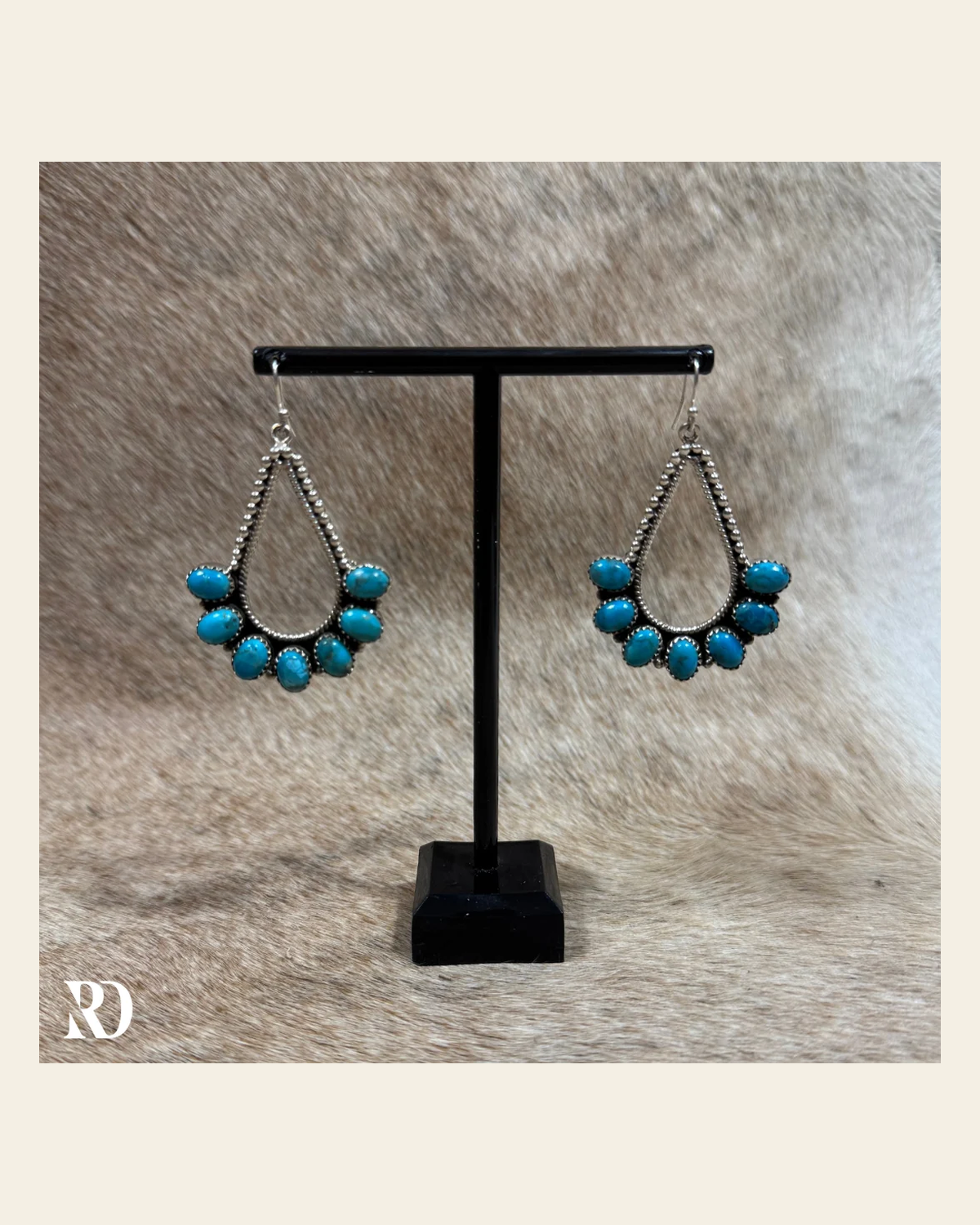 Hada Collection Kingman Turquoise Chandelier Style Drop Earrings on a warm cream background