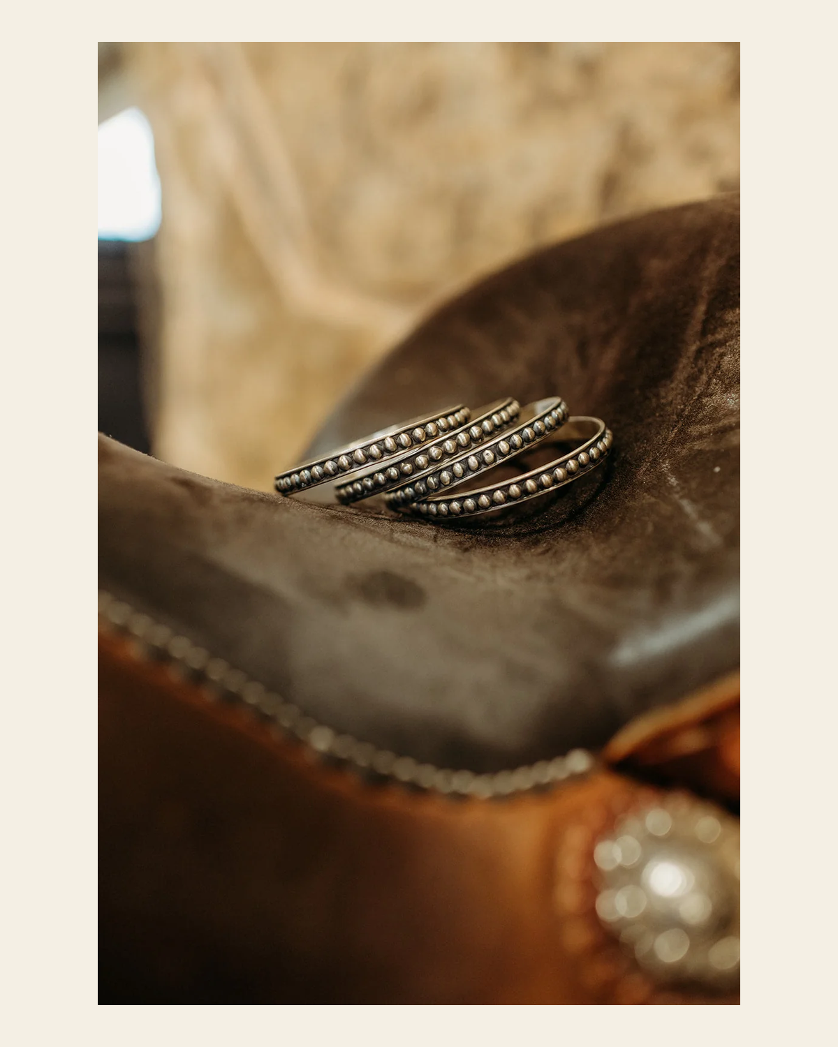 Hada Collection - Sterling Silver 4MM Ball Bangle Bracelet on a warm cream background