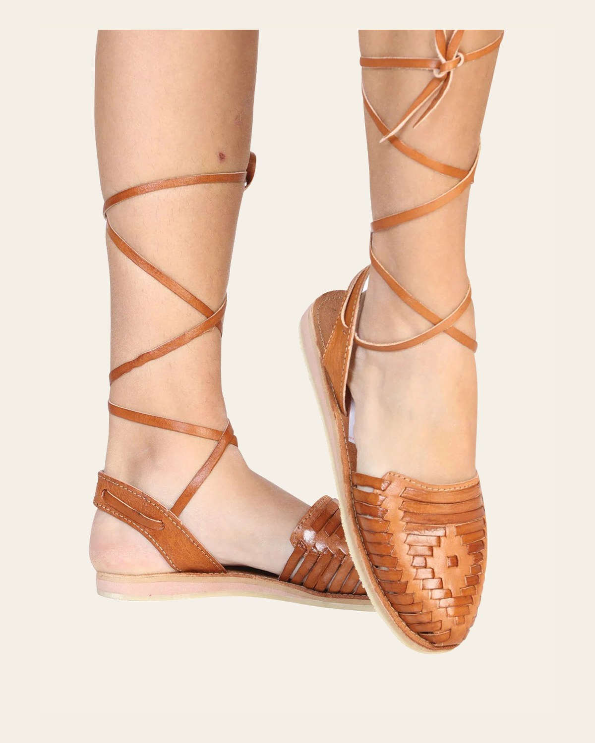 Mexican Artisanal Sandals Leather Natural 602367 on a warm cream background