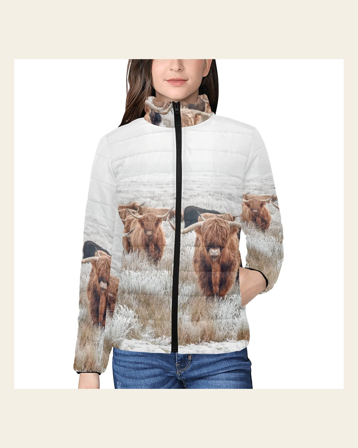 Highland Cow Herd Women's Puffy Bomber Jacket on a warm cream background