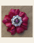 Hot Pink Carnation Flower With Bright Silver Pink & Jet 1" Concho on a warm cream background