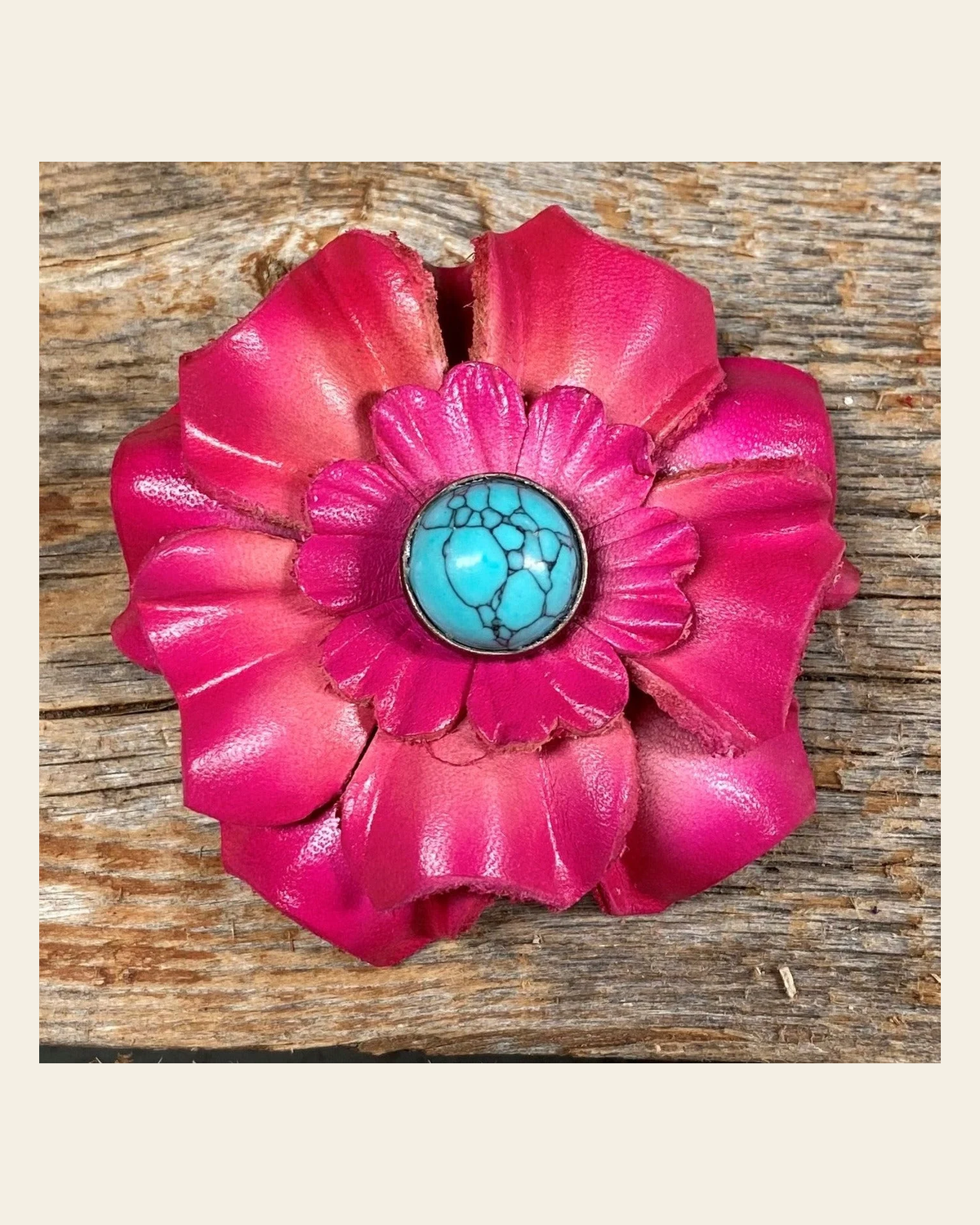 Hot Pink Carnation Flower With Round Turquoise Cabochon on a warm cream background