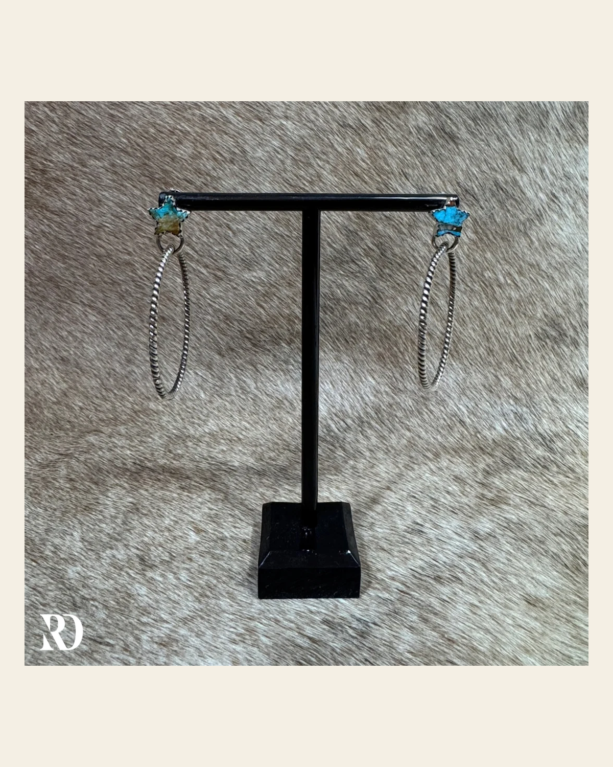 Ice Blue Dahlia Star Hoop Earrings - Hada Collection on a warm cream background