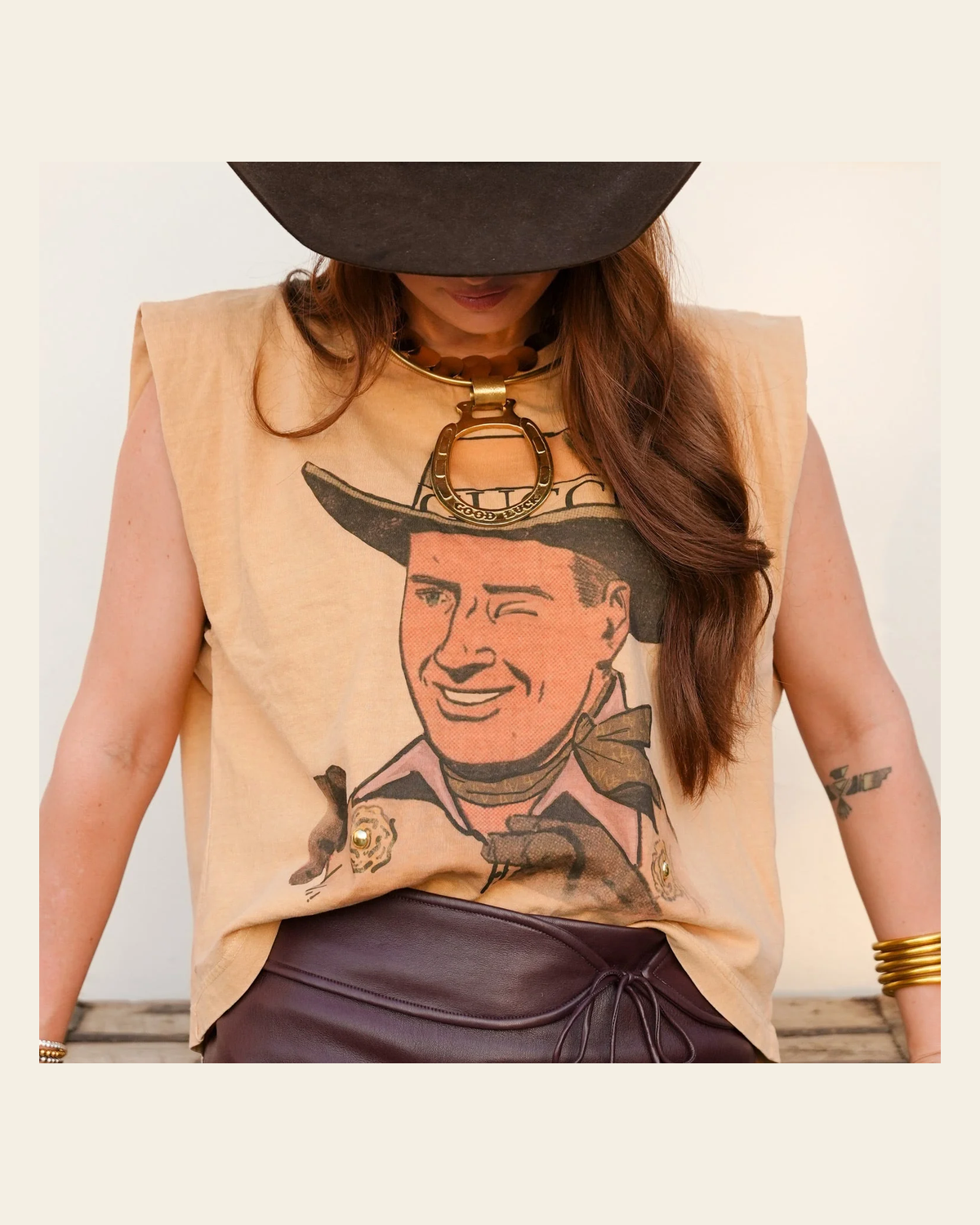 It's All Gucci Cowboy Muscle | Tee on a warm cream background