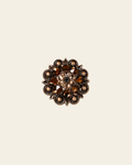Jet Champagne & Topaz Copper 1.25" European Crystal Concho on a warm cream background