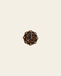 Jet & Topaz Copper 1" European Crystal Concho on a warm cream background