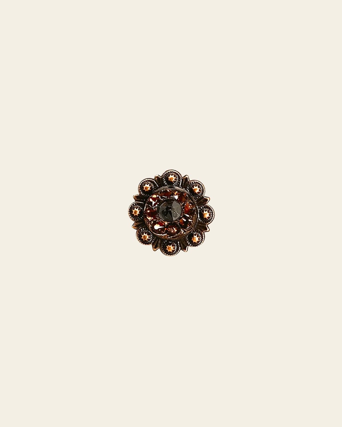 Jet & Topaz Copper 1" European Crystal Concho on a warm cream background
