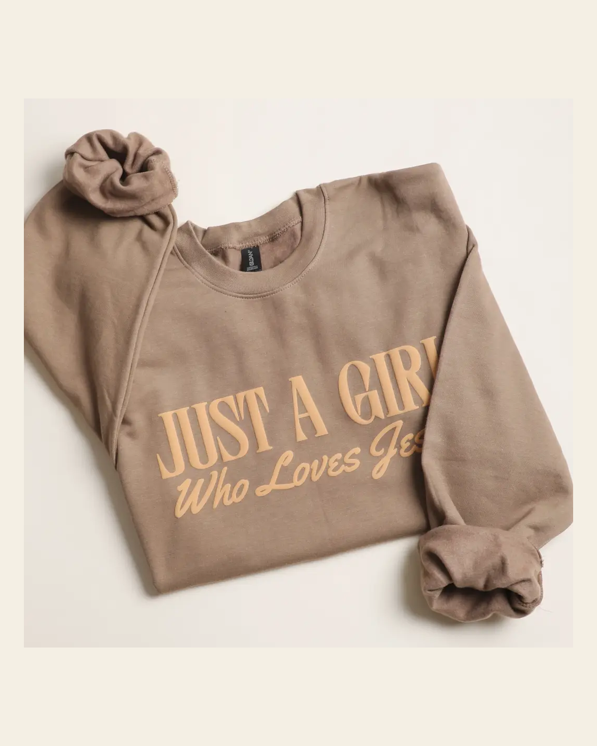 Just A Girl Who Loves Jesus | Crewneck on a warm cream background