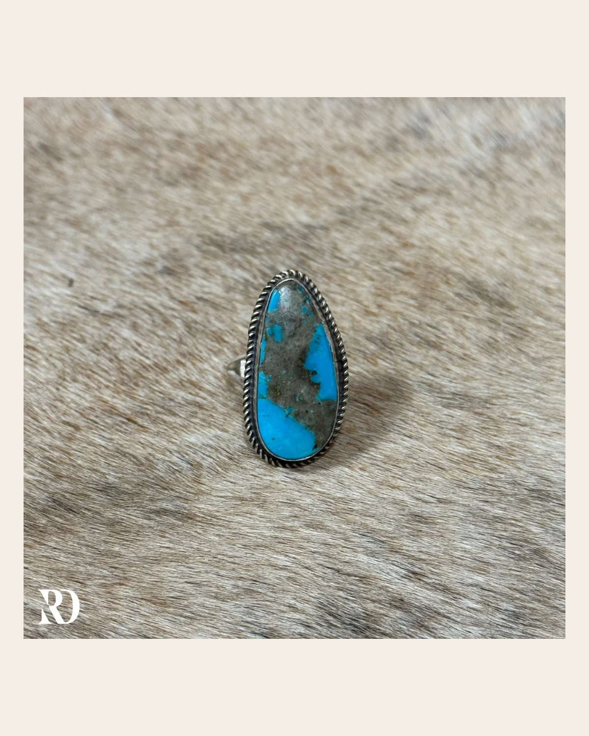 Kingman Turquoise Adjustable Ring By Donovan Nez on a warm cream background