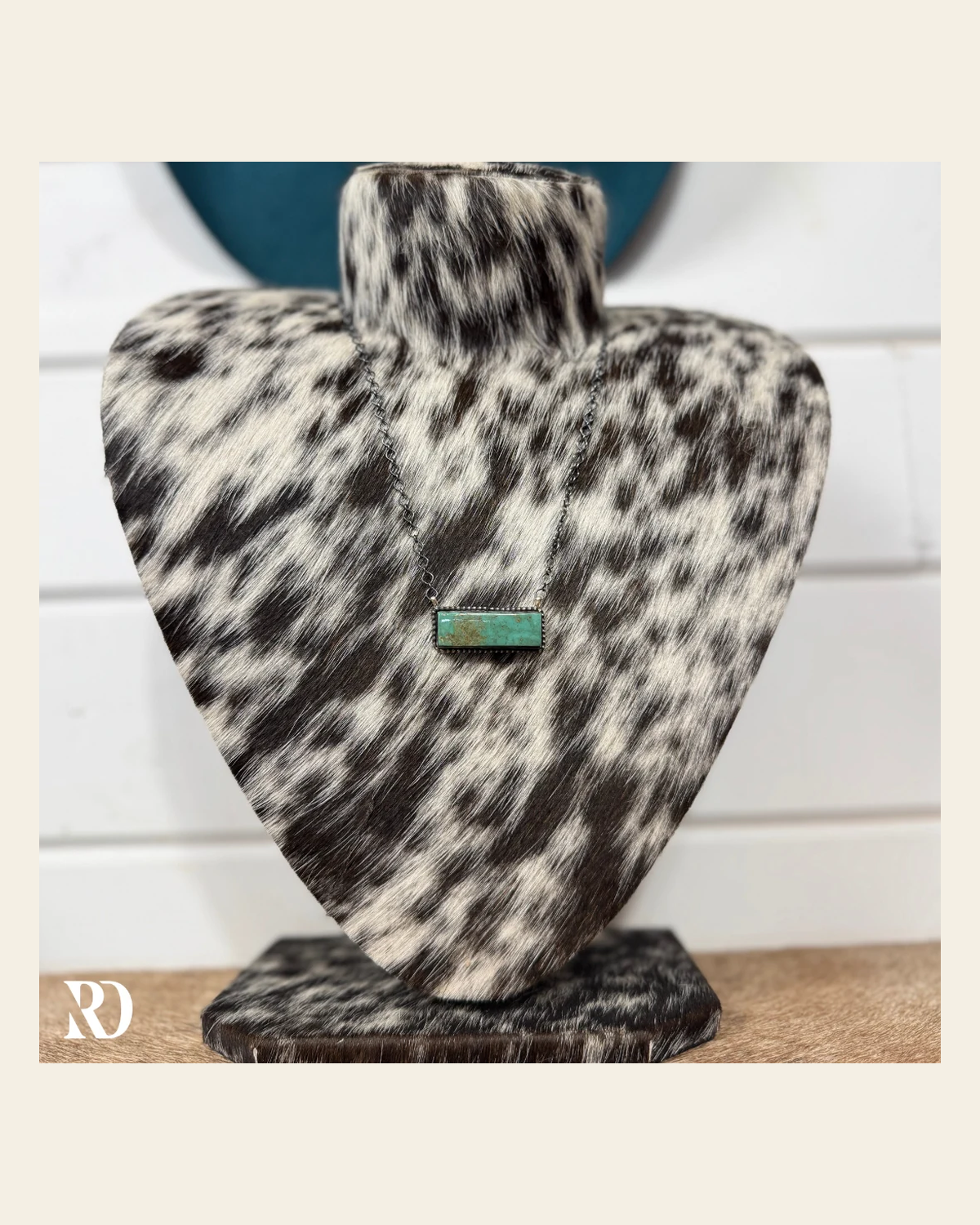 Kingman Turquoise Bar Necklace By Tia Long on a warm cream background