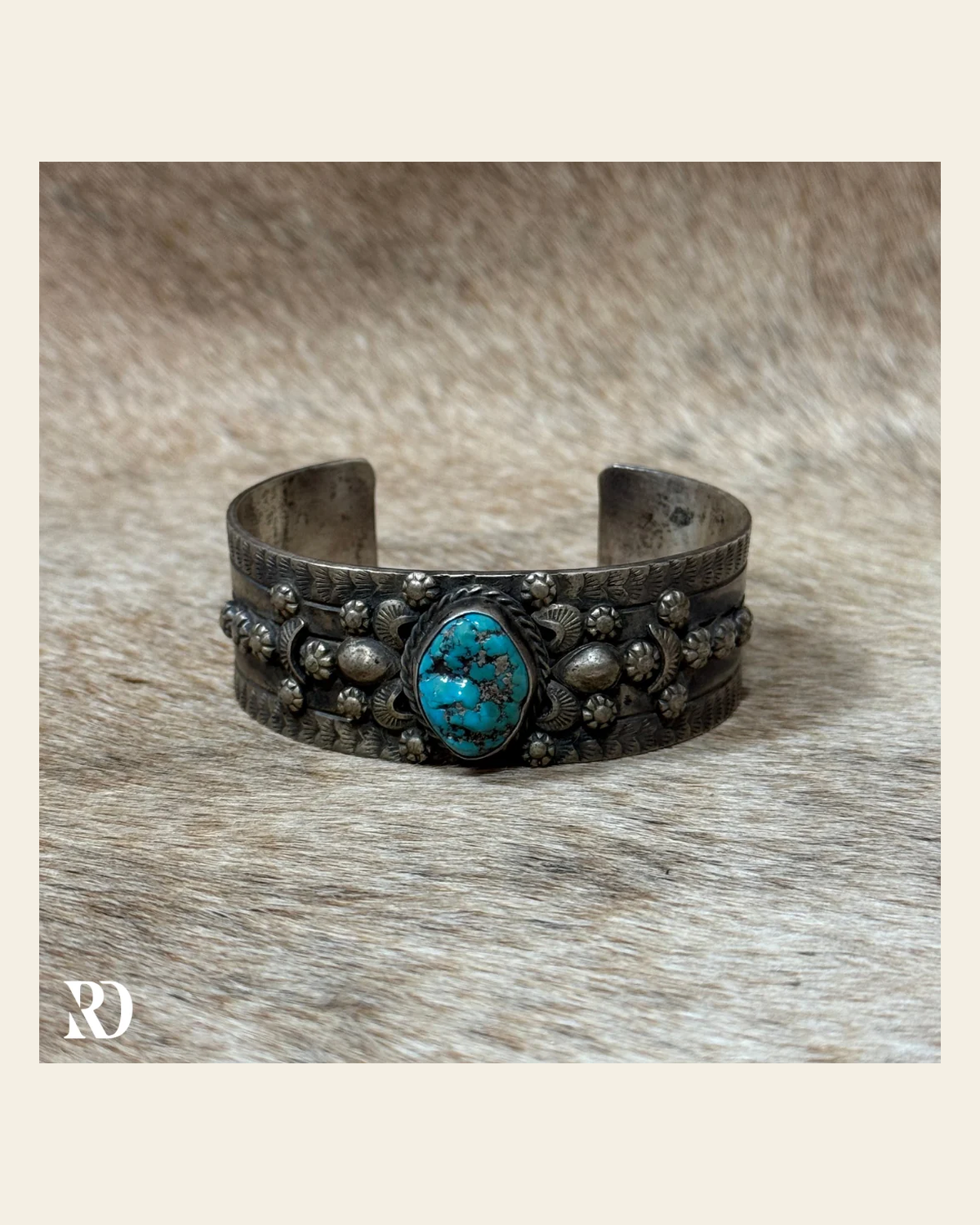 Kingman Turquoise Cuff By Betta Lee on a warm cream background