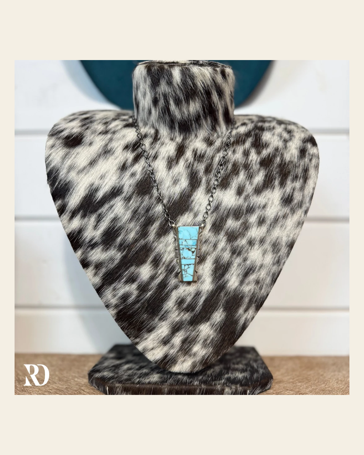 Kingman Turquoise Necklace By Steve Francisco on a warm cream background