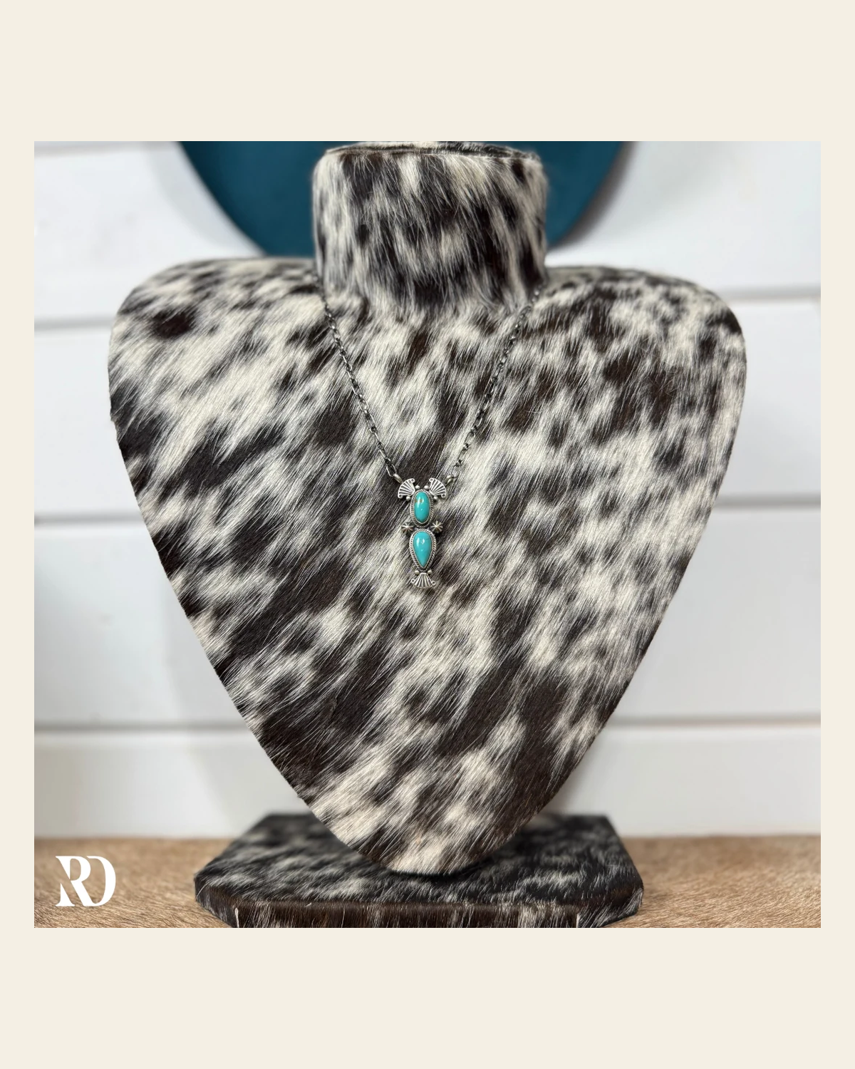Kingman Turquoise Necklace By Verley Betone on a warm cream background
