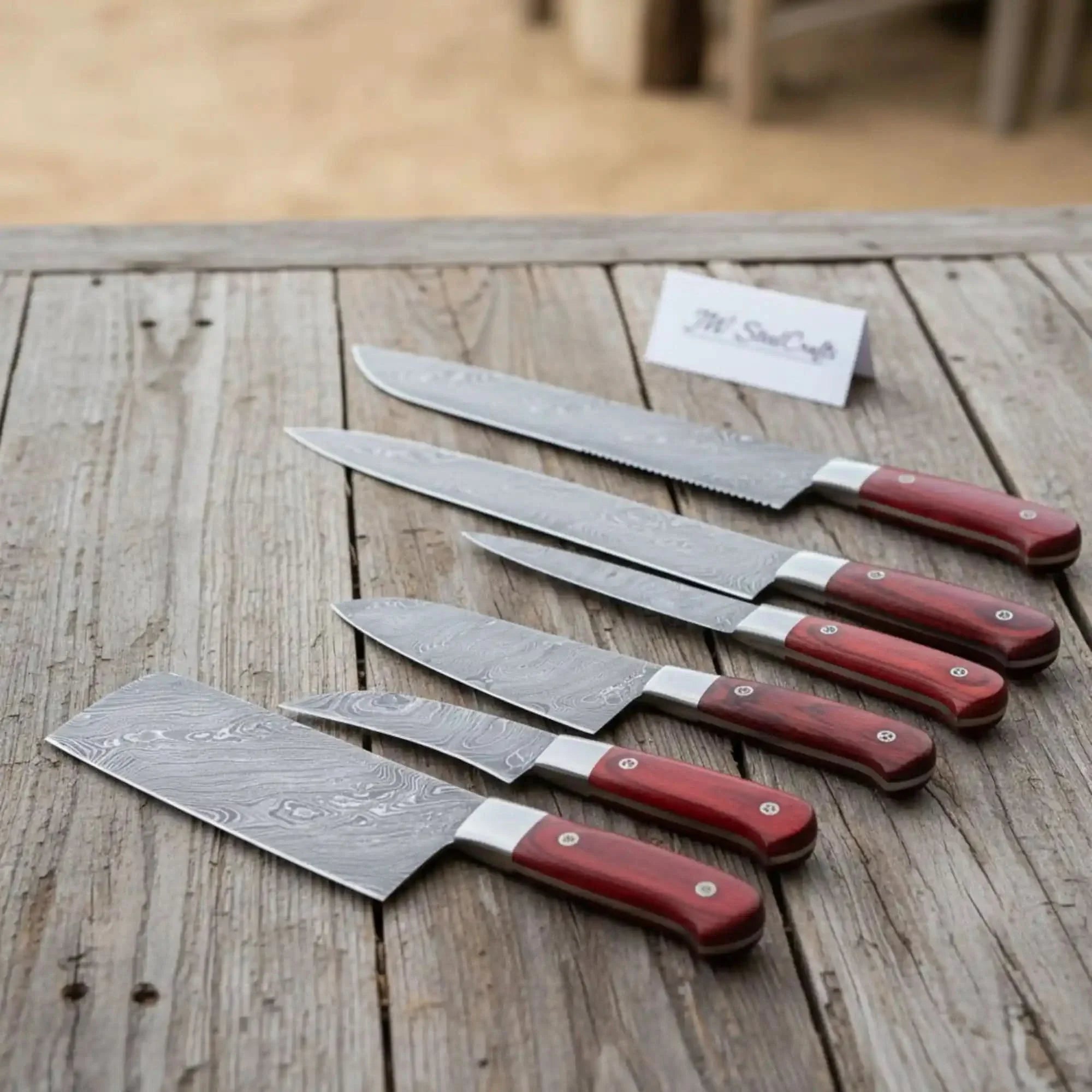 7-Piece Kitchen Knife Set with Vegetable Cleaver with Red Pakka Wood Handles and Swirl Damascus Blades