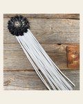 Leather Black Daisy with White Fringe on a warm cream background