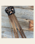 Leather Black Lotus with Copper Fringe on a warm cream background