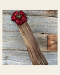 Leather Red Gardenia with Copper Fringe on a warm cream background