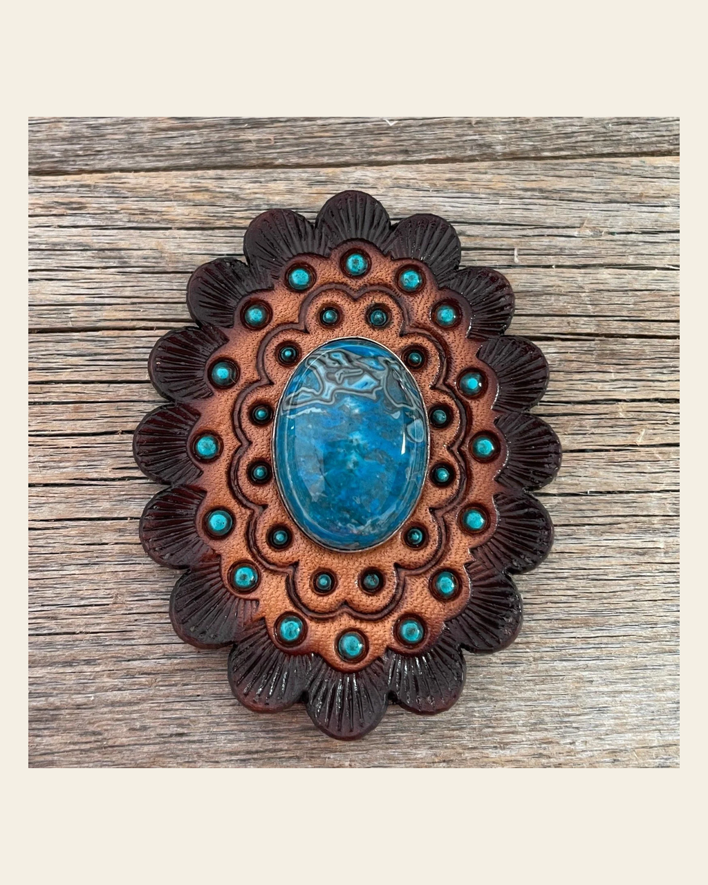Leather Rosette Dark Oil Edges with Blue Cabochon Western Concho R104CABBL on a warm cream background