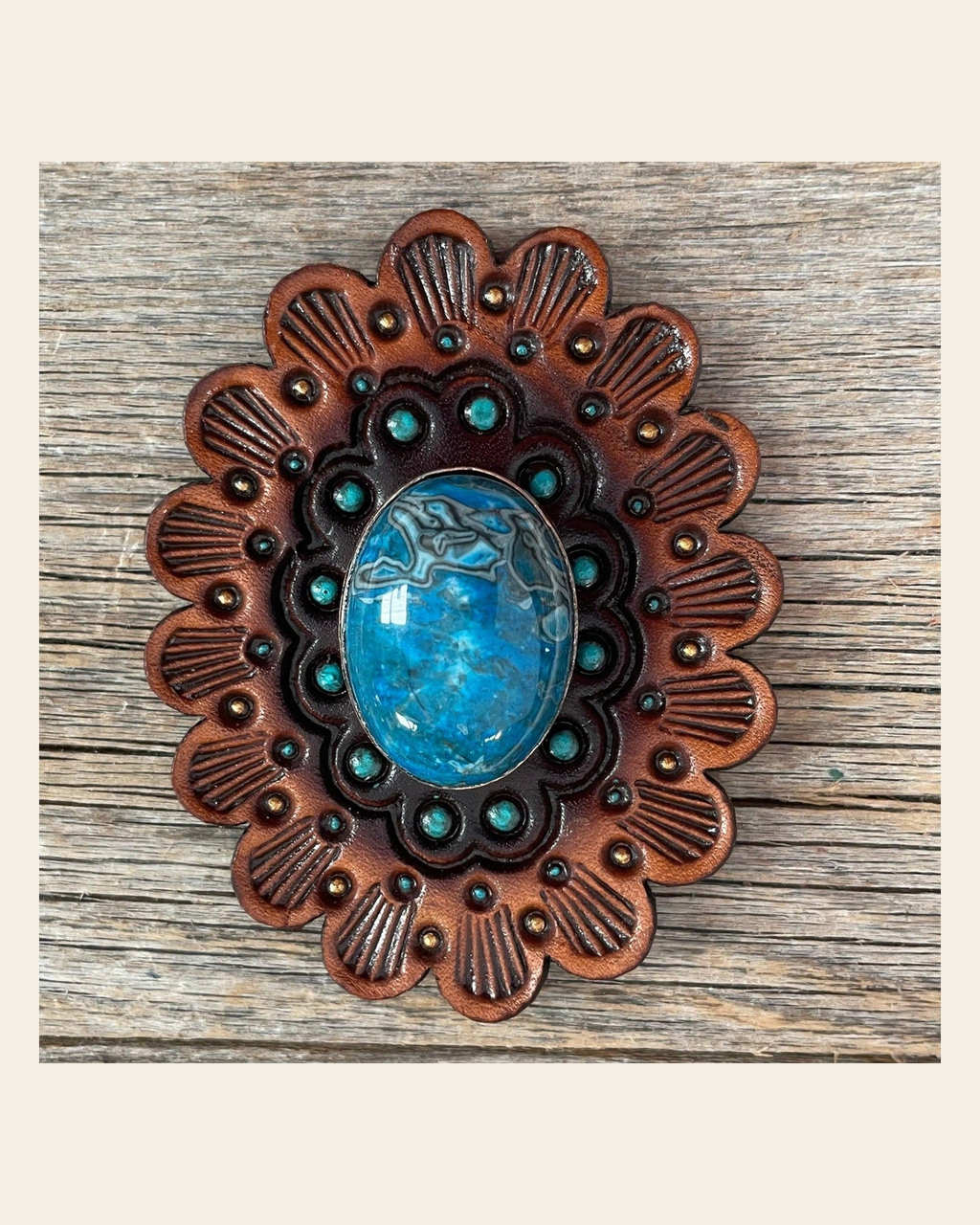 Leather Rosette Medium Oil Edges with Blue Cabochon Western Concho R107CABBL on a warm cream background