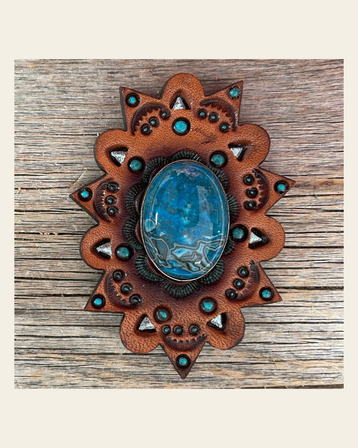 Leather Rosette Starburst - Blue Cabochon Western Concho R110CABBL on a warm cream background