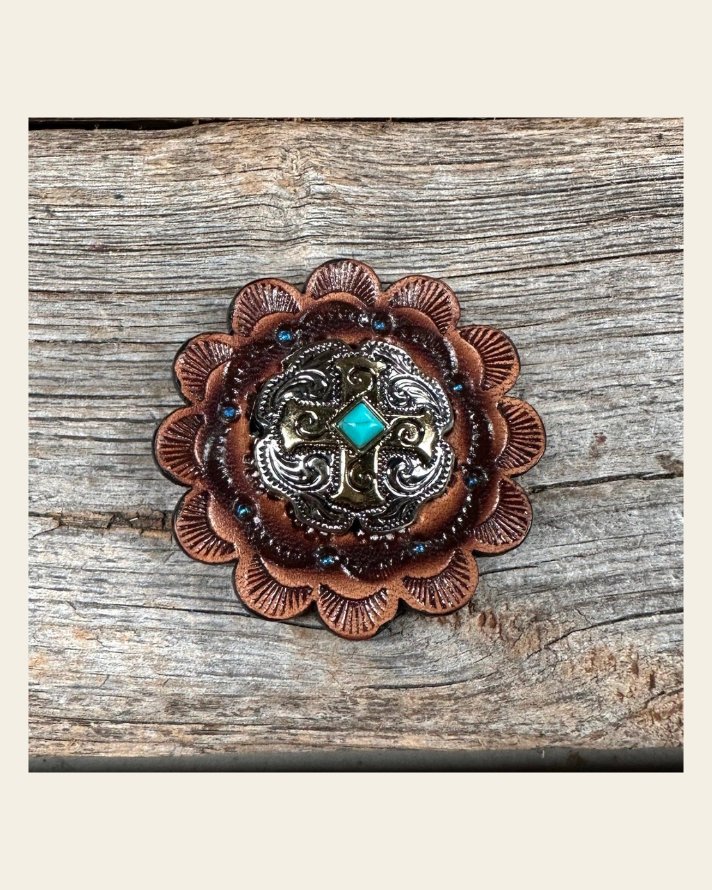 Leather Rosette with Antique Silver and Gold Cross Western Concho R111W189S on a warm cream background