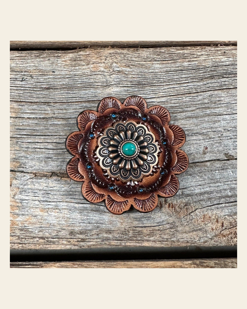 Leather Rosette with Floral Western Concho R111W103S on a warm cream background