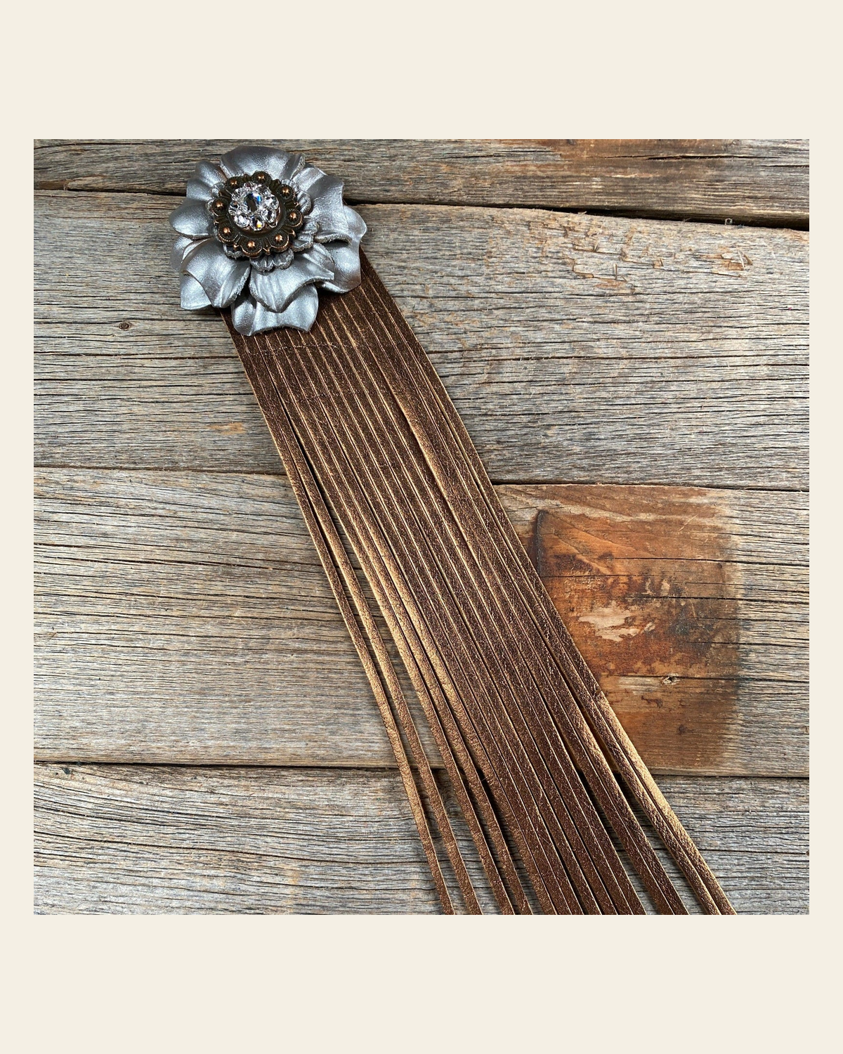 Leather Silver Carnation with Copper Fringe on a warm cream background