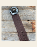 Leather Silver Gardenia with Brown Fringe on a warm cream background