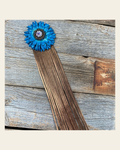 Leather Turquoise Daisy with Copper Fringe on a warm cream background