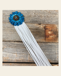 Leather Turquoise Daisy with White Fringe on a warm cream background