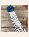 Leather Turquoise Gardenia with White Fringe on a warm cream background