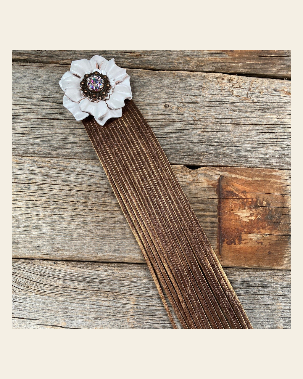 Leather White Carnation with Copper Fringe on a warm cream background