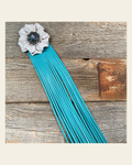 Leather White Carnation with Turquoise Fringe on a warm cream background