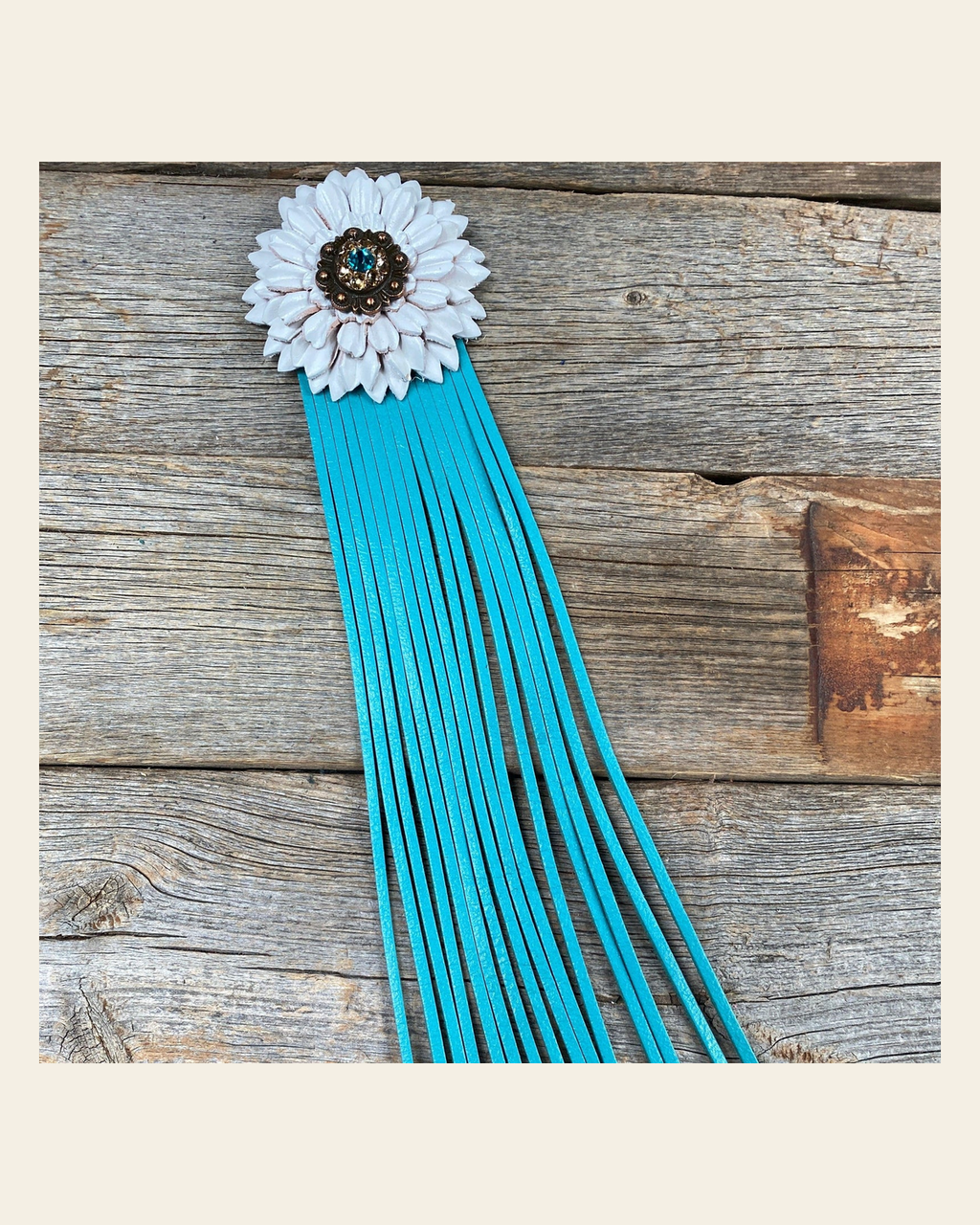 Leather White Daisy with Turquoise Fringe on a warm cream background