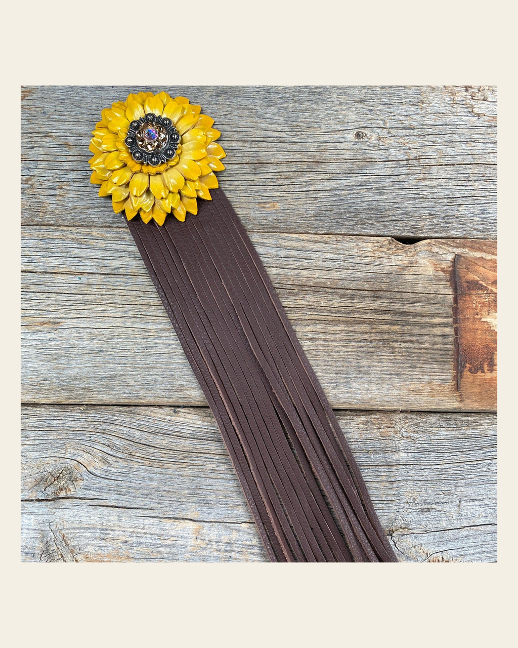 Leather Yellow Daisy with Brown Fringe on a warm cream background
