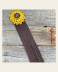 Leather Yellow Daisy with Brown Fringe on a warm cream background